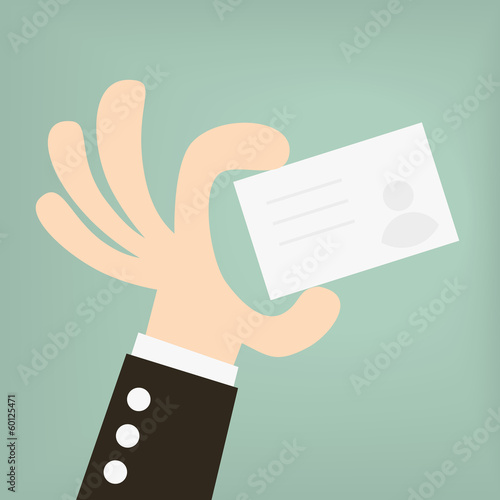 businessman holding a business card