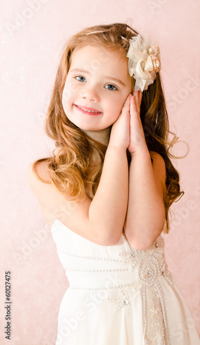 Happy adorable little girl in princess dress