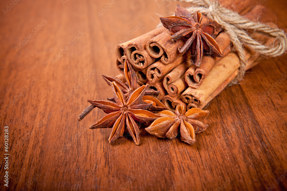 cinnamon sticks and star anise on a wooden background cinnamon sticks and star anise on a wooden background