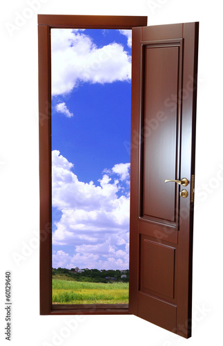 Field view through an open door isolated on white