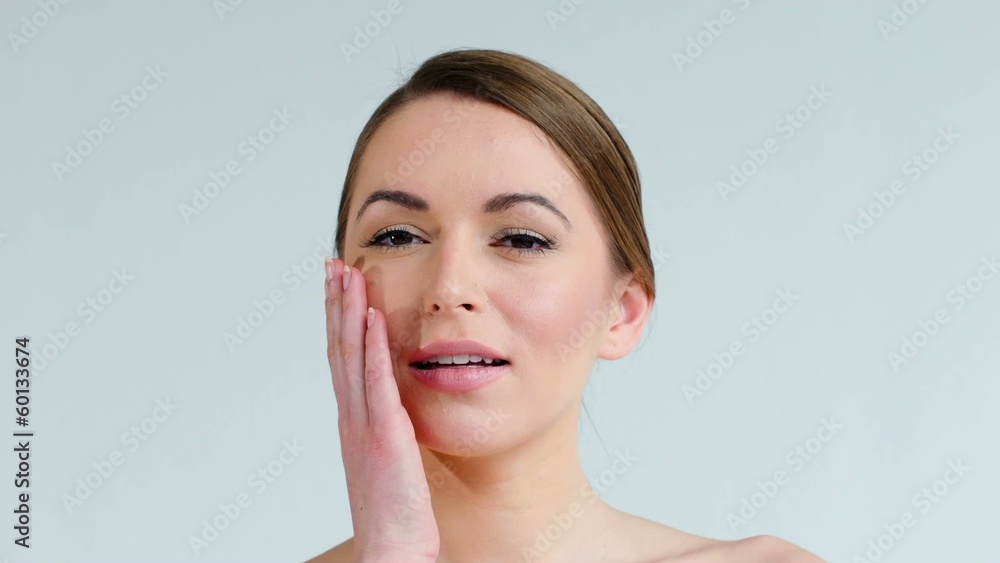 Cute Girl Touching Her Cheek While Posing Isolated on Gray Cute Girl Touching Her Cheek While Posing Isolated on Gray
