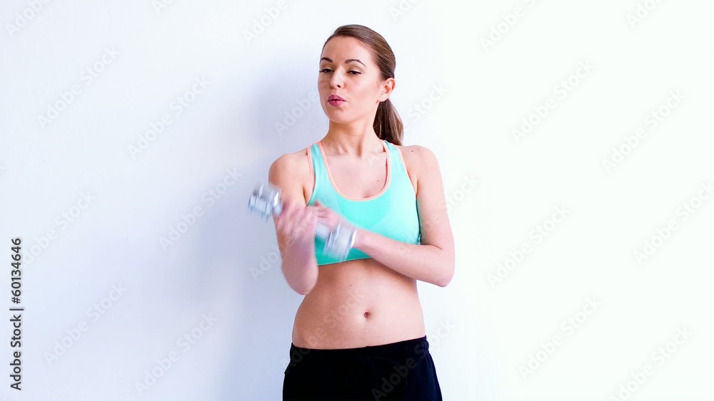 Cute Caucasian Woman Doing Exercises With Dumbbell Cute Caucasian Woman Doing Exercises With Dumbbell