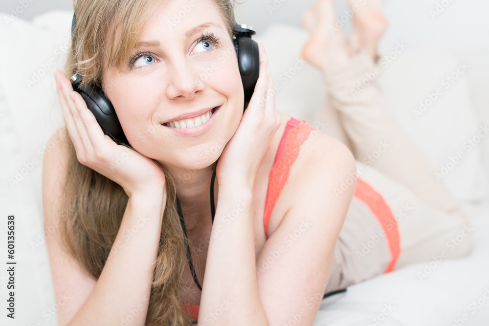 Young beautiful woman enjoying the music at home Young beautiful woman enjoying the music at home