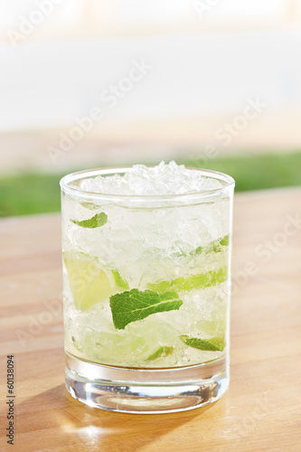 Classic mojito cocktail by a pool outdoors