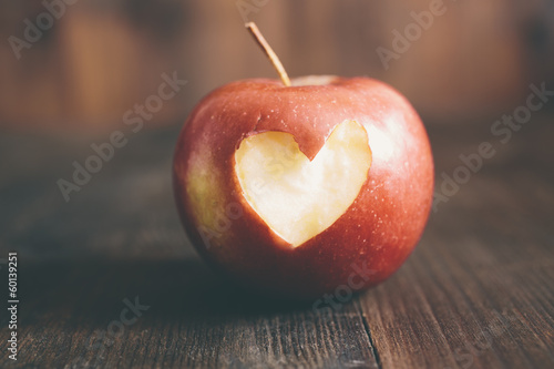 Apple with a heart cut into it
