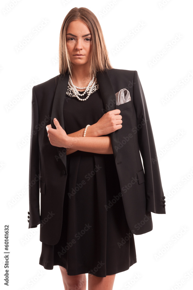 Fototapeta premium Beautiful young woman wearing a black dress and a man's jacket