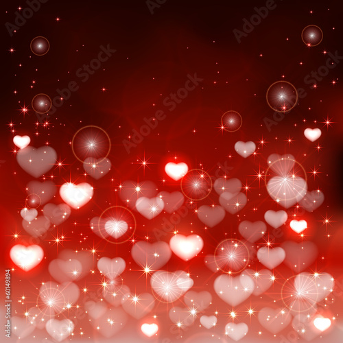 Blurry hearts on red background
