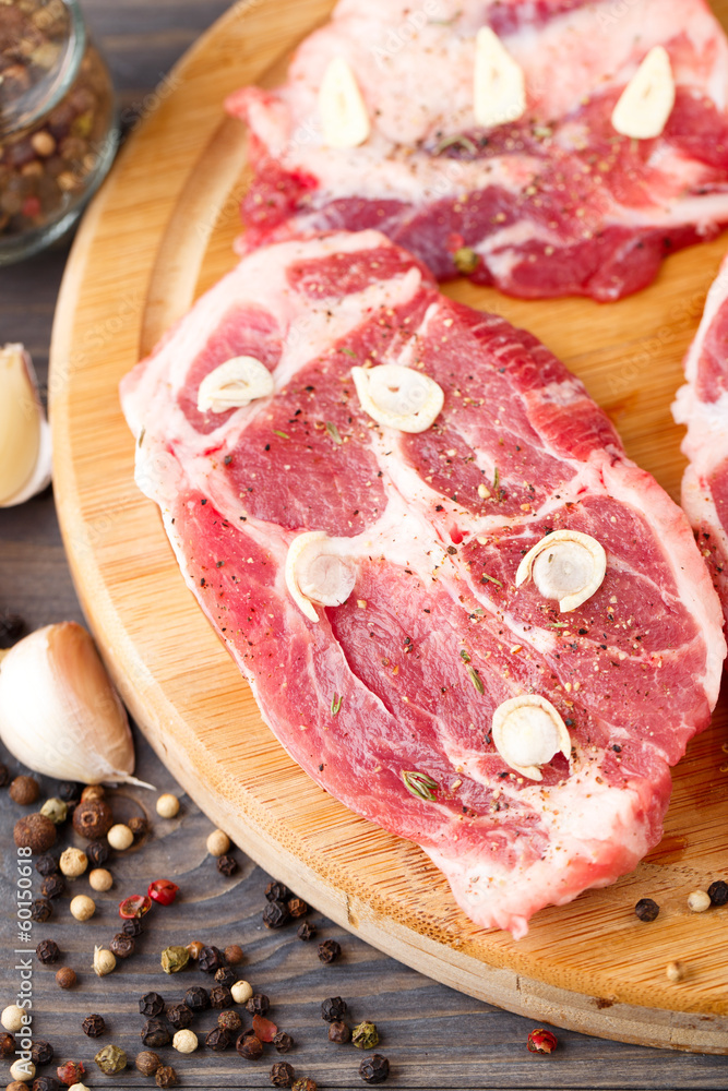 Raw steak on a cutting board.