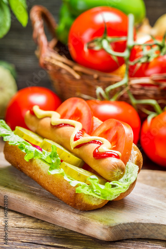 Closeup of homemade hot dog with fresh vegetables