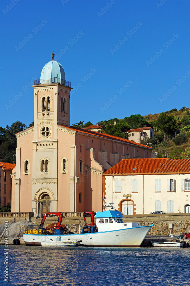 Mediterranean church with fishing boat