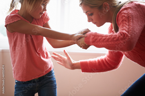 Mother Hitting Young Daughter photo