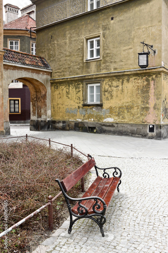 Empty bench in an old town in Warsaw #60161465