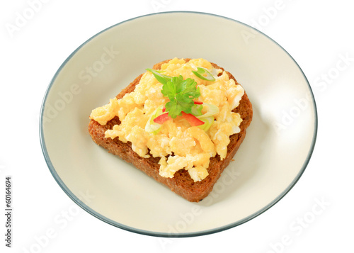 Scrambled eggs on fried bread