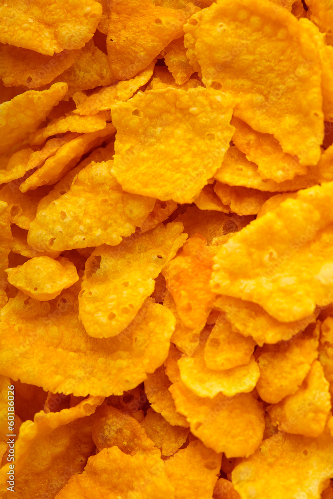 Closeup of corn flakes breakfast morning meal as food background Closeup of corn flakes breakfast morning meal as food background
