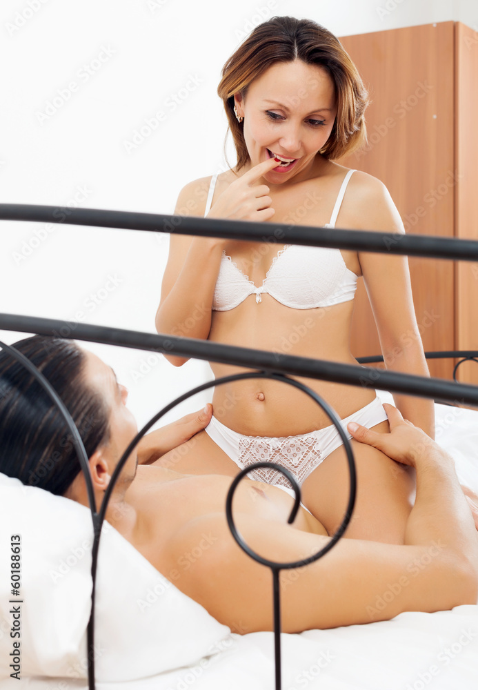 Brunette woman in underwear having sex with man Stock Photo | Adobe Stock