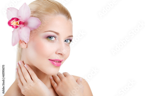 portrait of Beautiful woman With Orchid Flower in her hair