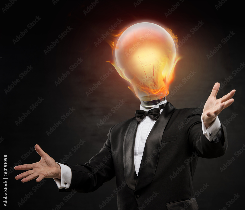 Businessman with burning lamp head on black background. Welcomin Businessman with burning lamp head on black background. Welcomin
