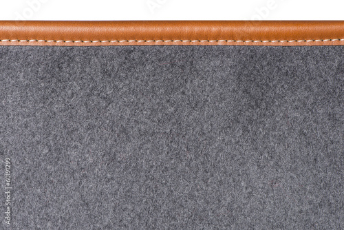Macro of sewn leather binding of rug