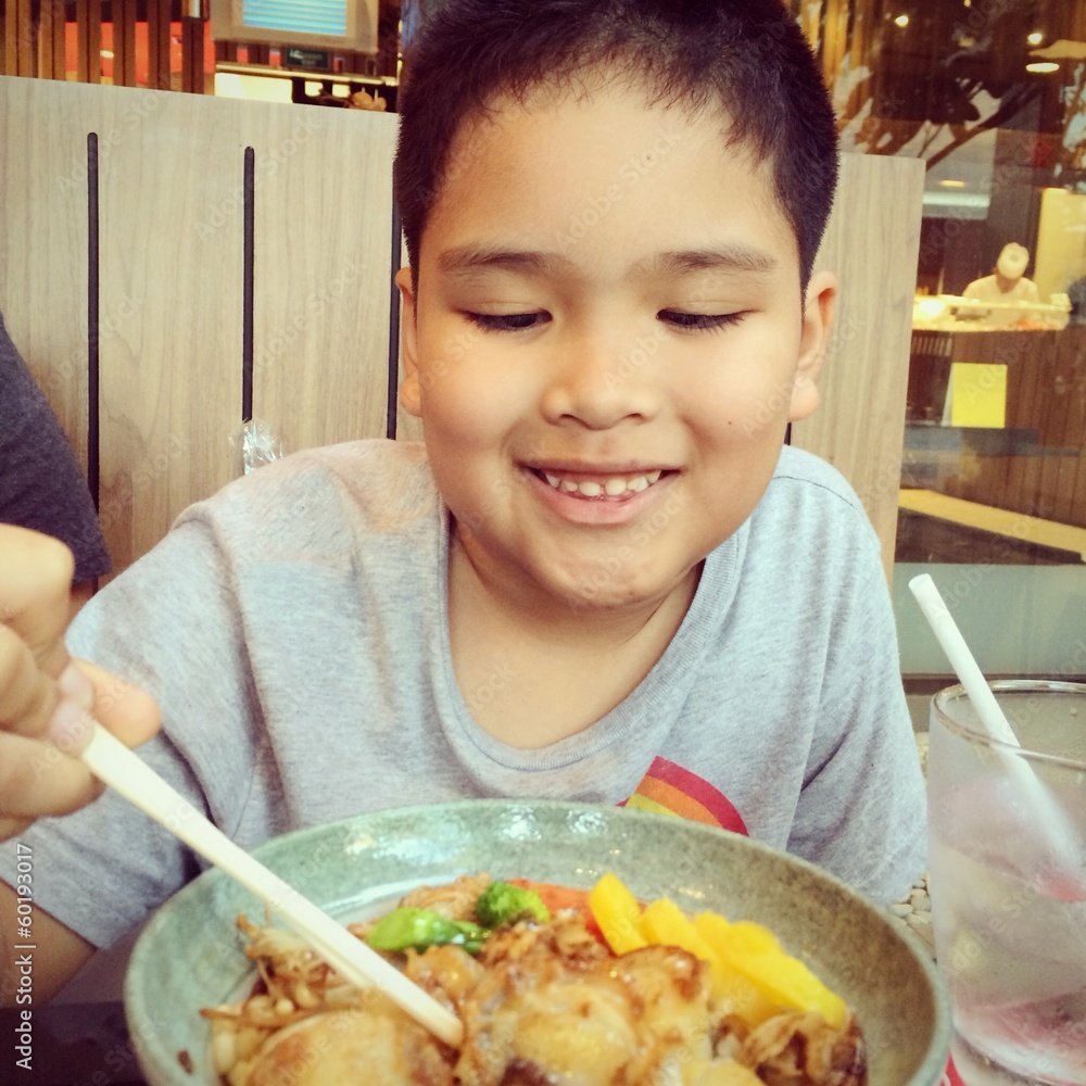 boy enjoy eating shells with rice japanese food boy enjoy eating shells with rice japanese food