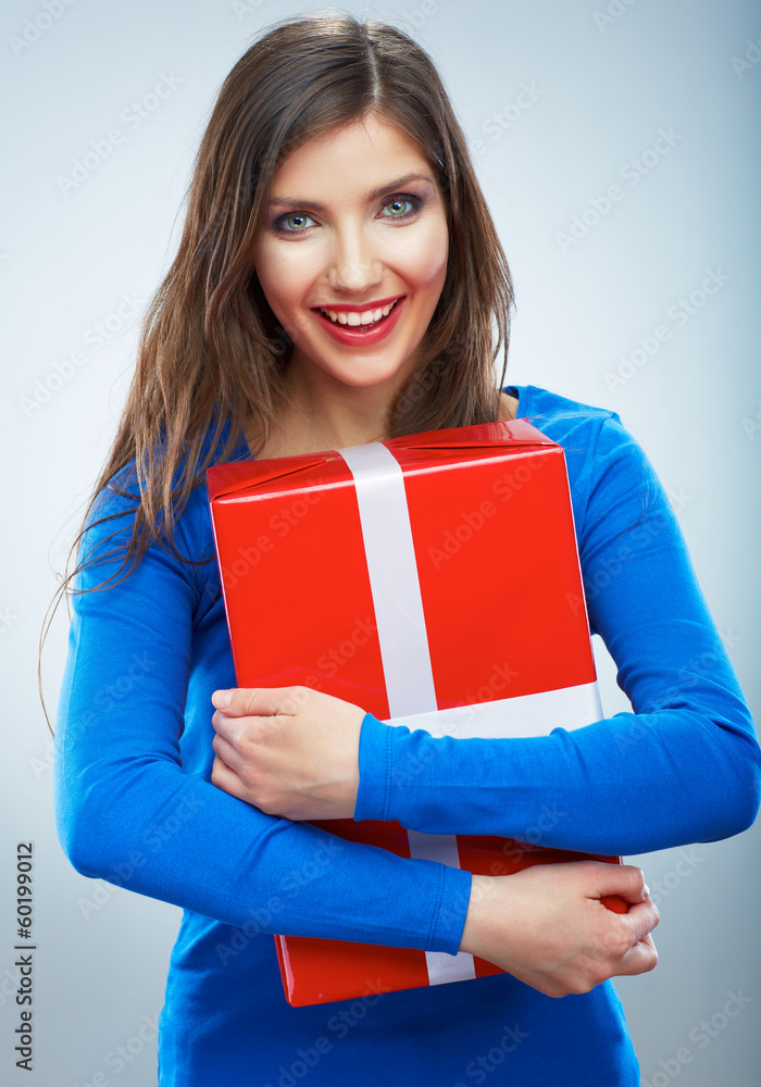 Portrait of young happy smiling woman hold red gift box. Isolat Portrait of young happy smiling woman hold red gift box. Isolat