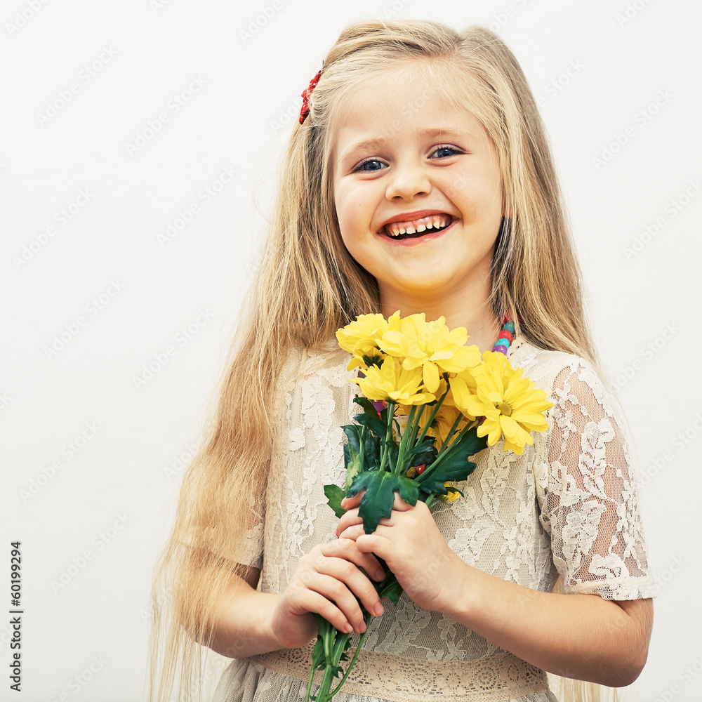 Smiling Girl hold yellow flowers.