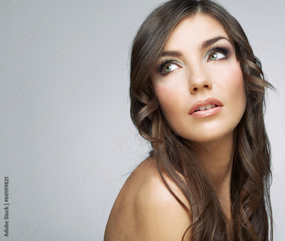 Obraz premium Woman face close up beauty portrait. Girl with long hair lookin