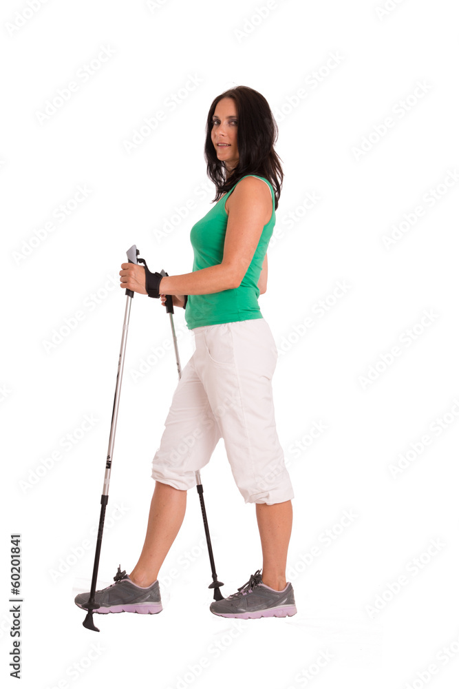 Woman with long black hair at nordic walking Woman with long black hair at nordic walking