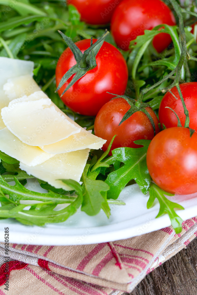 fresh salad from rucola, cherry tomatoes and parmesan cheese fresh salad from rucola, cherry tomatoes and parmesan cheese