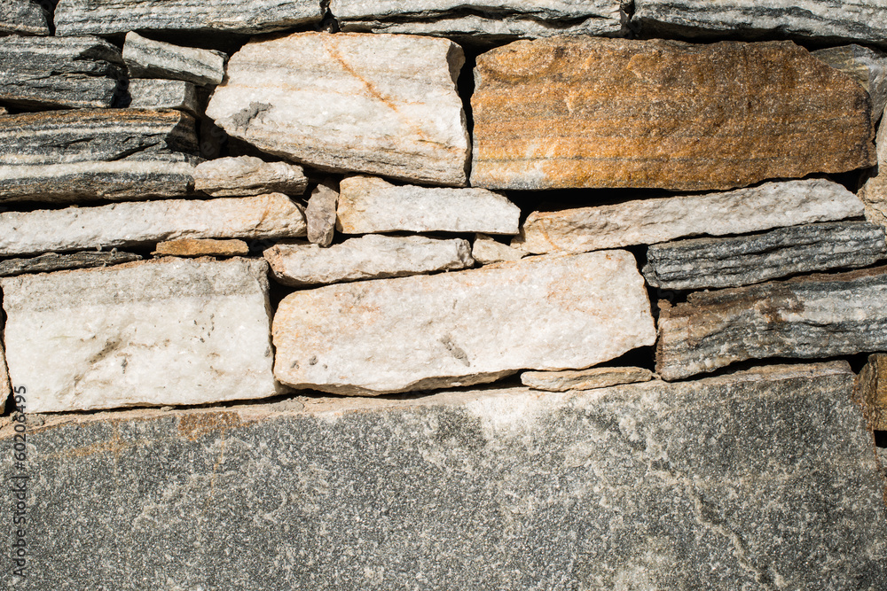 Wall built of stones. Sun light Wall built of stones. Sun light