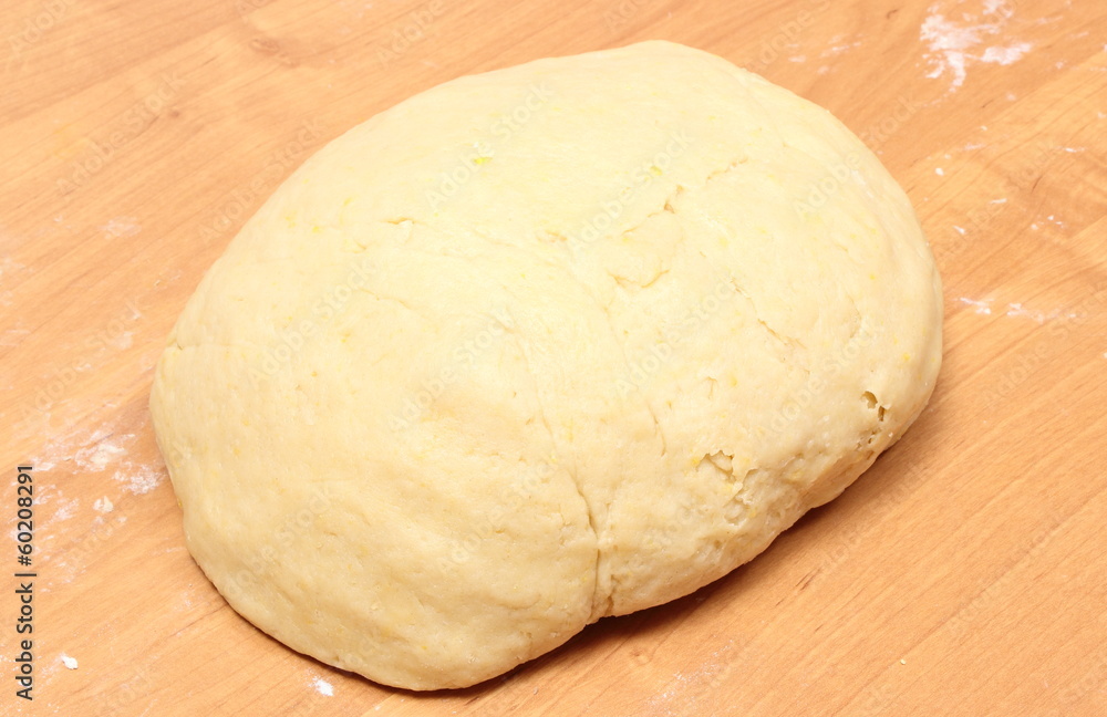 Yeast cake lying on wooden table Yeast cake lying on wooden table