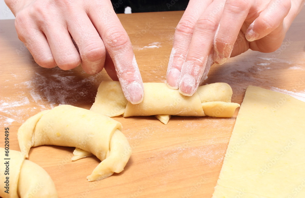 Hand of woman preparing fresh croissants with jam Hand of woman preparing fresh croissants with jam