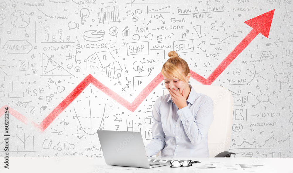 Business woman sitting at table with market diagrams Business woman sitting at table with market diagrams