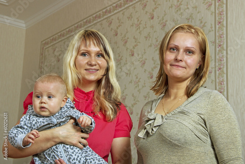 Two women and infant. photo