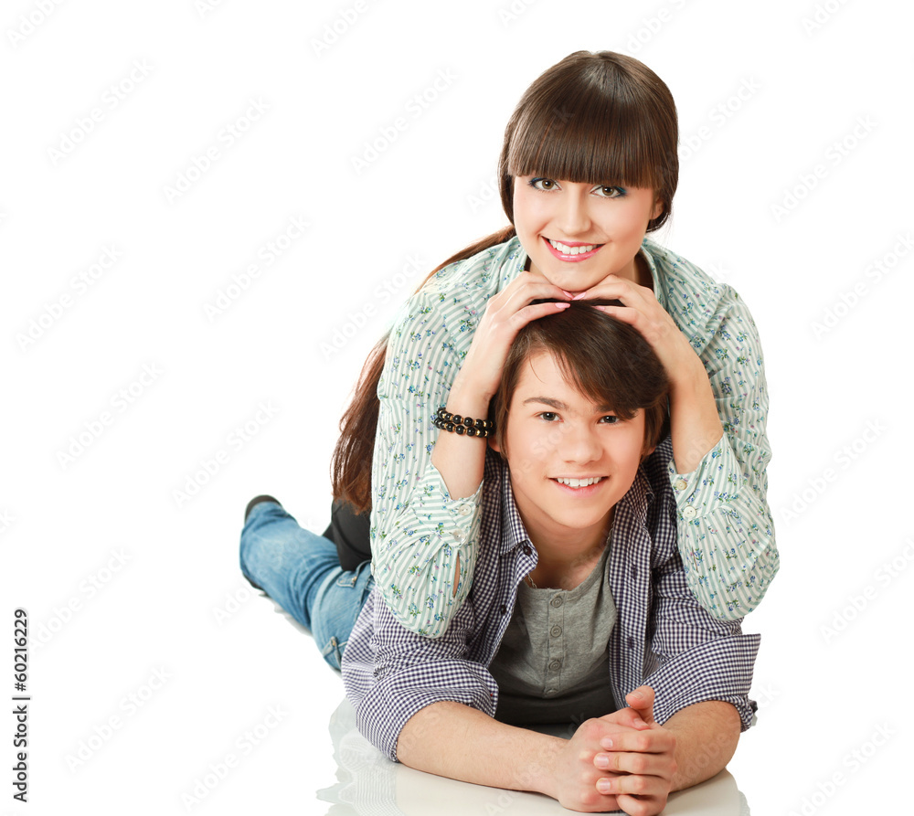 A young loving couple lying on the floor A young loving couple lying on the floor