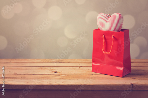 Valentine's day background with shopping bag and heart shape