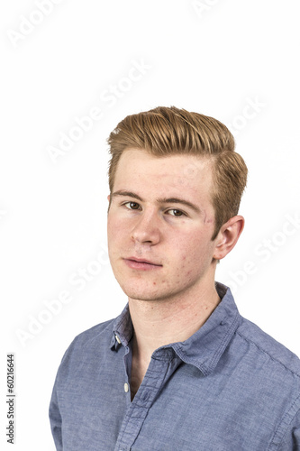 cool boy with red hair posing in studio