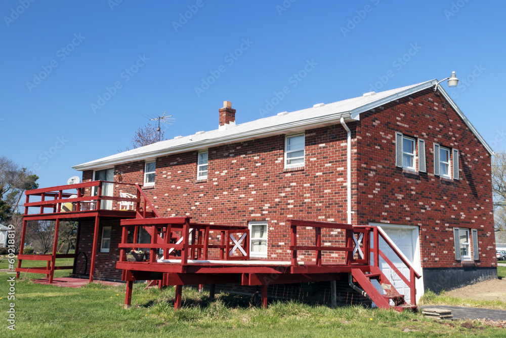 Rear View of Brick House and Deck