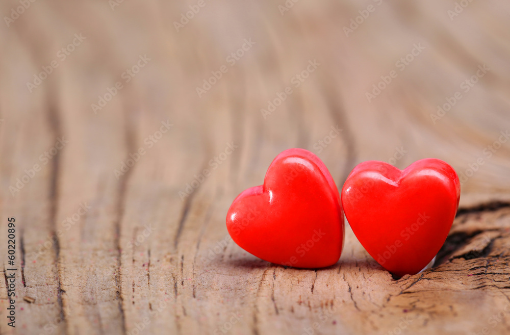 Fototapeta premium Hearts on Wooden Texture. Valentines Day background. Macro.