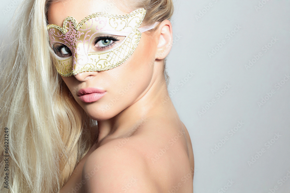 Beautiful Blond Woman in a Carnival Mask.Masquerade. Sexy Girl
