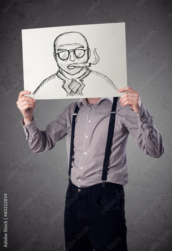 Businessman holding a cardboard with a smoking man on it in fron Businessman holding a cardboard with a smoking man on it in fron