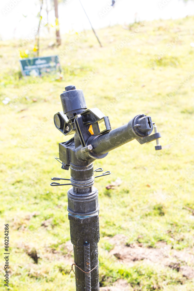 Water Sprinkler In A Field Water Sprinkler In A Field