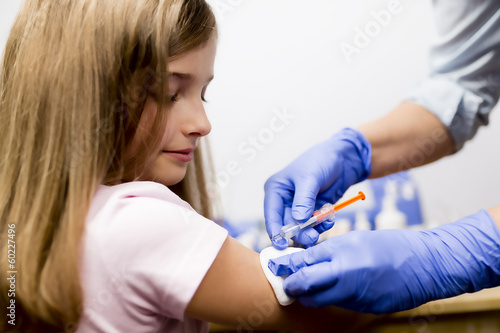 Vaccine - a doctor giving  vaccination girl  health  prevention
