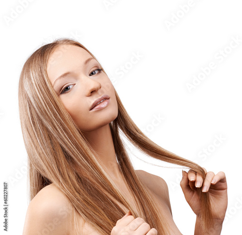 Portrait of young blonde on white background