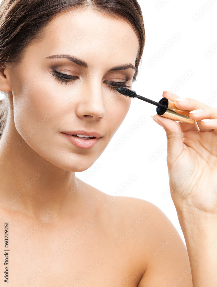 Young woman with cosmetics brush, isolated