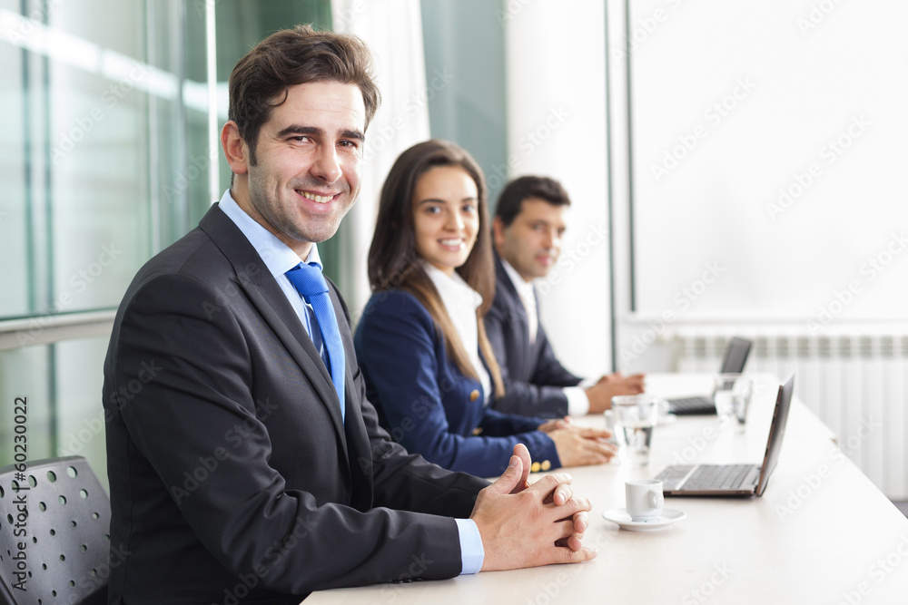 Business team smiling at the office, lined up Business team smiling at the office, lined up