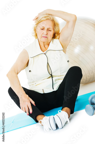 Senior Woman Exercising On Mat