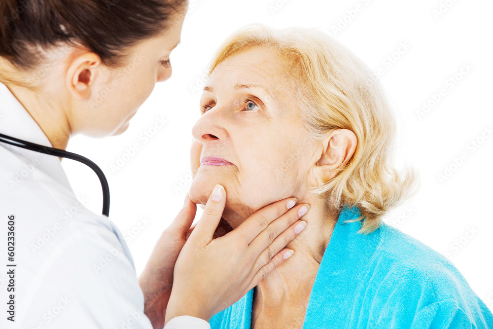 Doctor Examining Senior Woman's Throat Doctor Examining Senior Woman's Throat