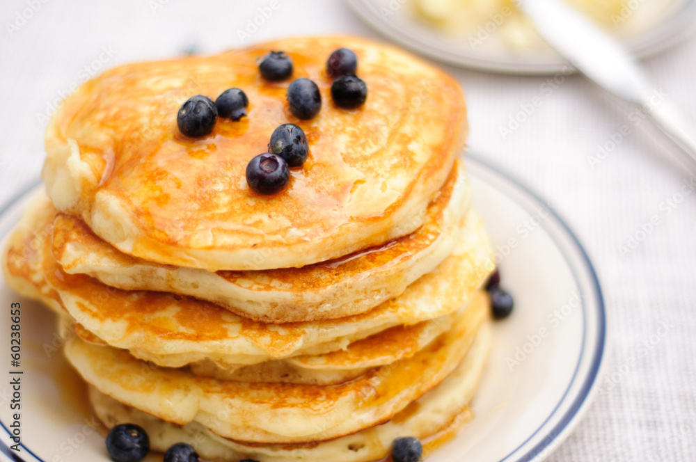 Blueberry pancakes with butter and honey Blueberry pancakes with butter and honey