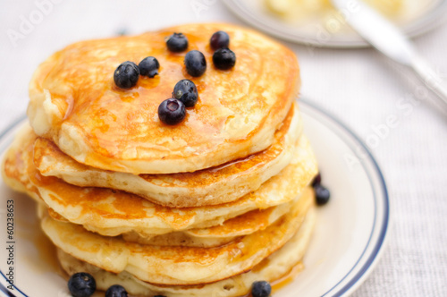 Blueberry pancakes with butter and honey