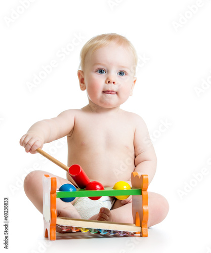 baby playing with color toy